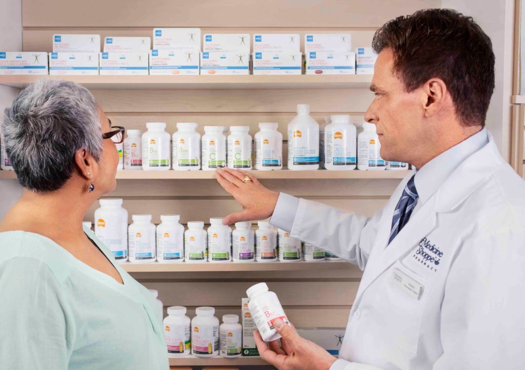 pharmacist assisting woman awareness